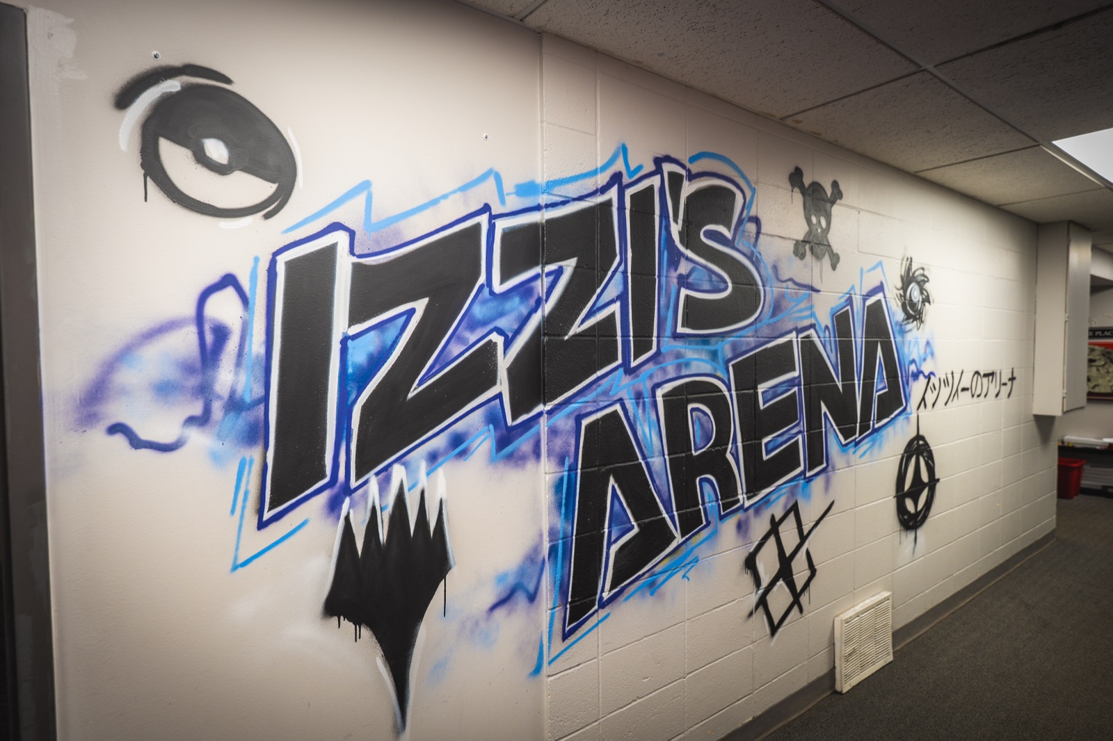 Izzi's Gym Arena mural inside the store