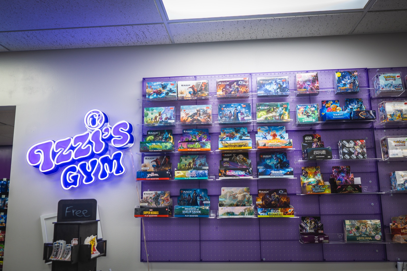 Izzi's Gym storefront and trading card wall